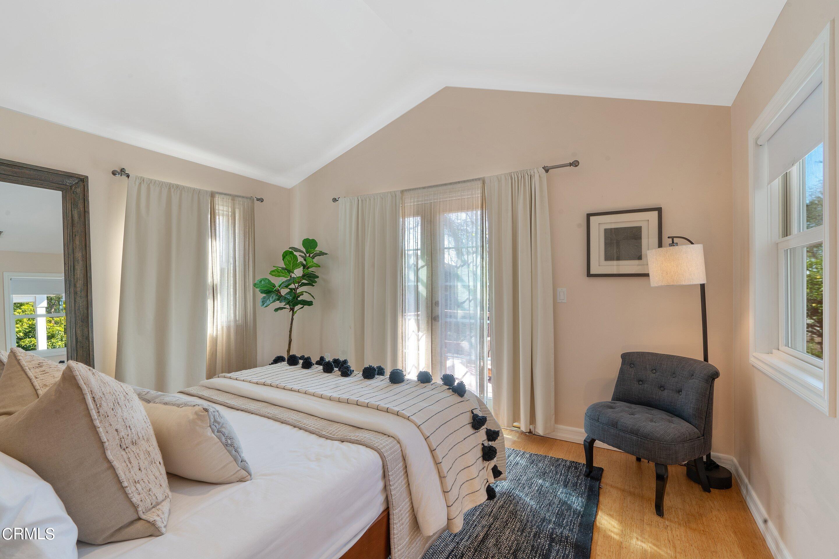 1532 Atchison Street Pasadena, CA 91104 - Photo 20 of 45 a bedroom with a bed chair and a window