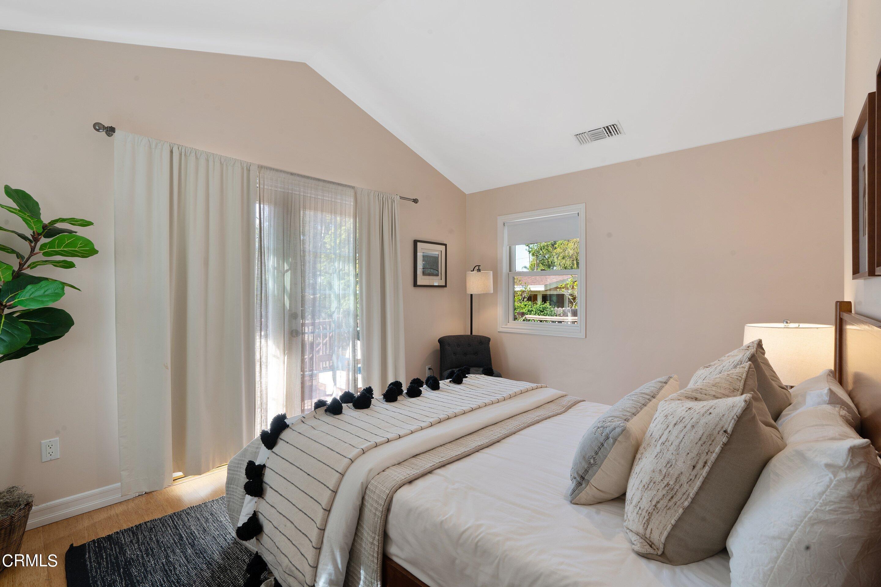 1532 Atchison Street Pasadena, CA 91104 - Photo 21 of 45 a bedroom with a bed and a window