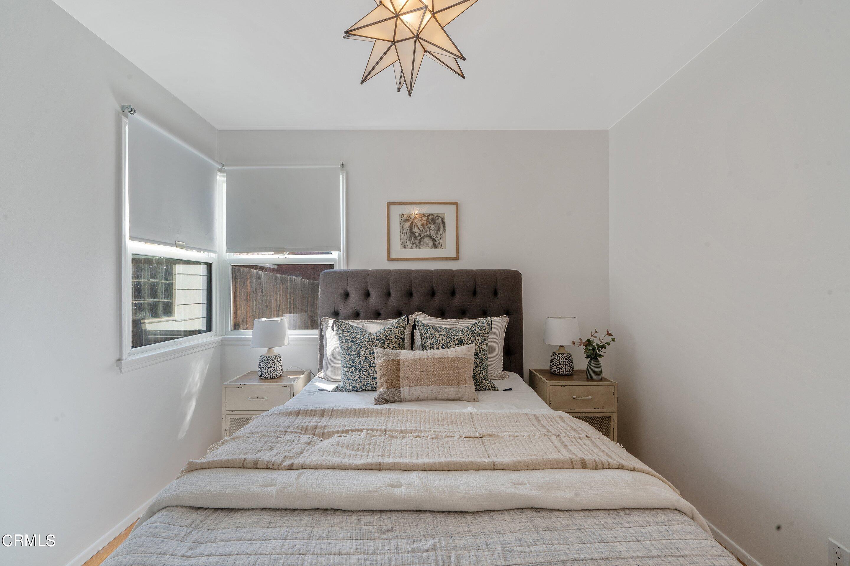 1532 Atchison Street Pasadena, CA 91104 - Photo 30 of 45 a spacious bedroom with a bed and window