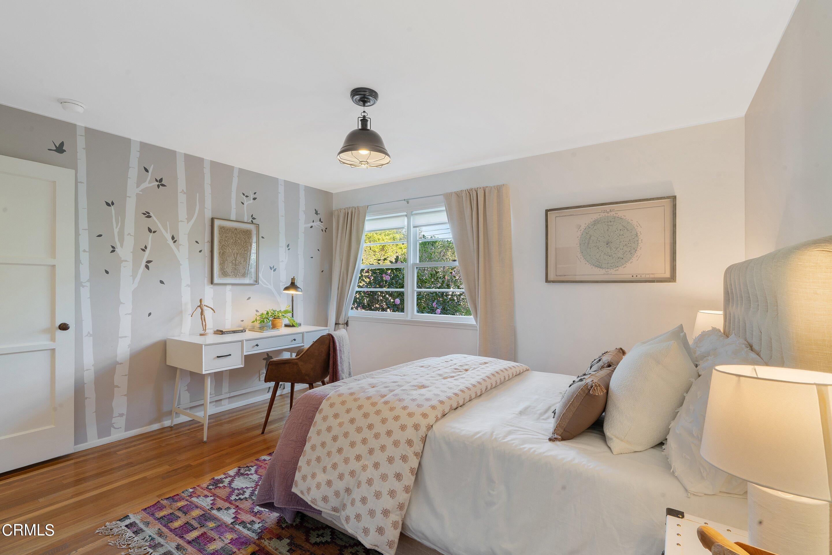 1532 Atchison Street Pasadena, CA 91104 - Photo 45 of 45 a bedroom with a bed and wooden floor