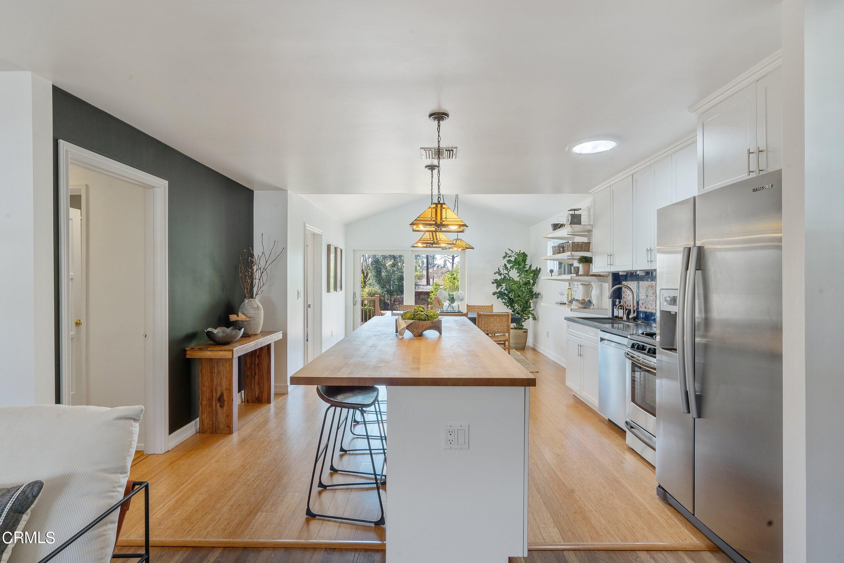 1532 Atchison Street Pasadena, CA 91104 - Photo 8 of 45 a kitchen with kitchen island a counter top space a sink stainless steel appliances and kitchen view