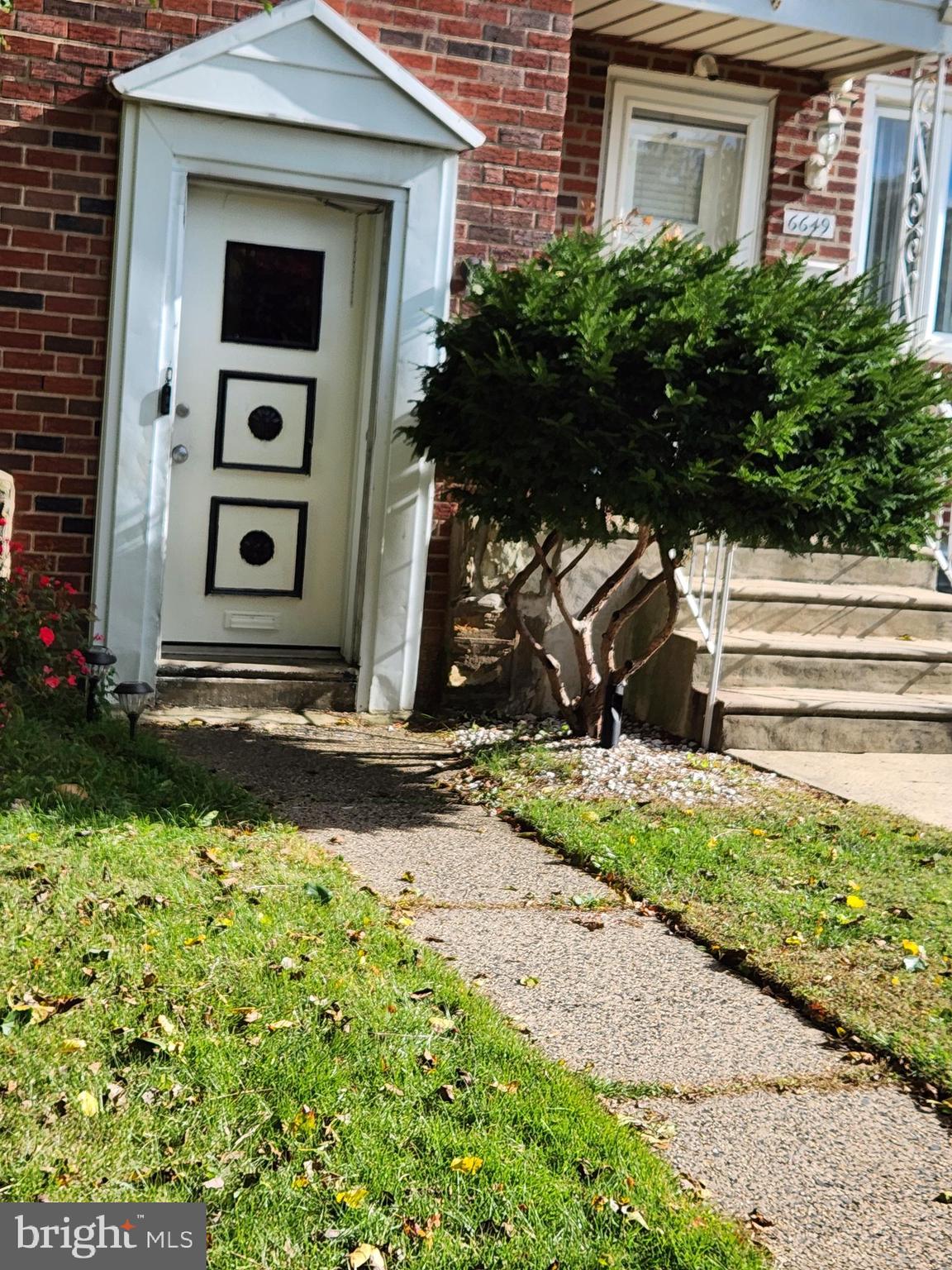 6651 Claridge Street Philadelphia, PA 19111 - Photo 1 of 26 a front view of a house with a yard