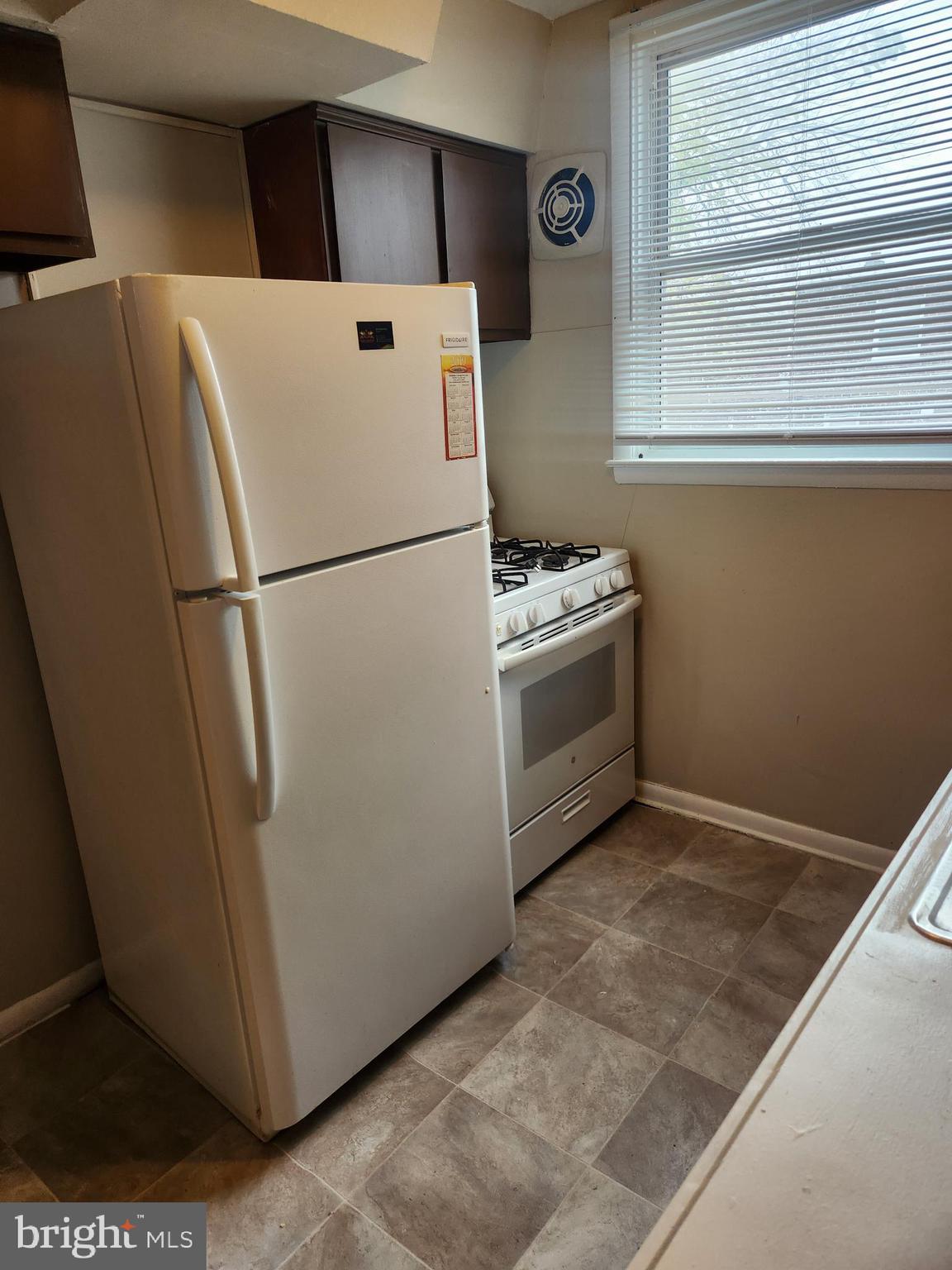6651 Claridge Street Philadelphia, PA 19111 - Photo 14 of 26 a white refrigerator freezer sitting inside of a kitchen