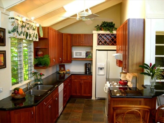 7267 Alamoo Road Hanalei, HI 96714 - Photo 7 of 15 a kitchen with stainless steel appliances a sink stove and refrigerator