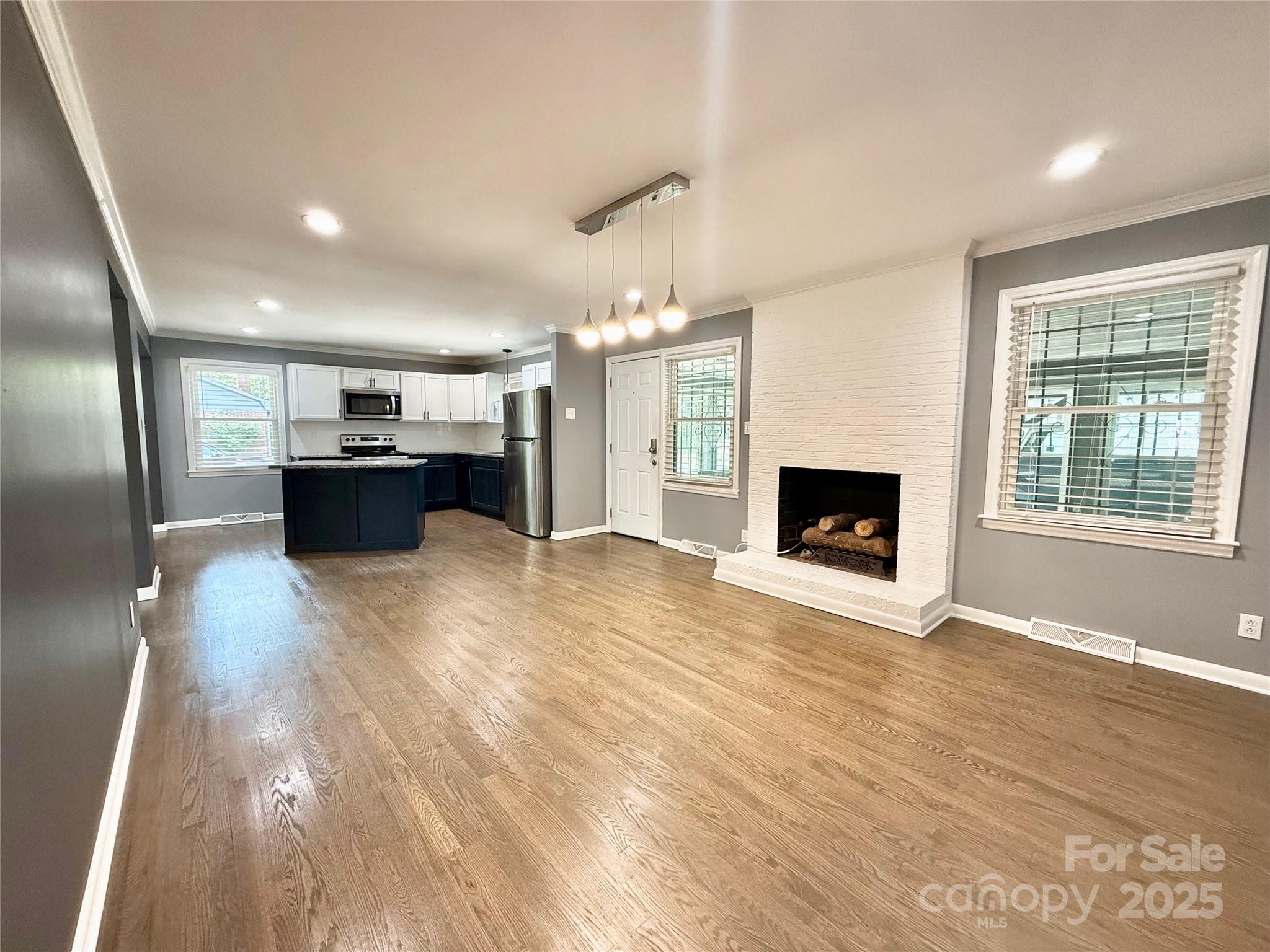 622 University Drive Rock Hill, SC 29730 - Photo 16 of 24 a view of a kitchen with a sink and a fireplace