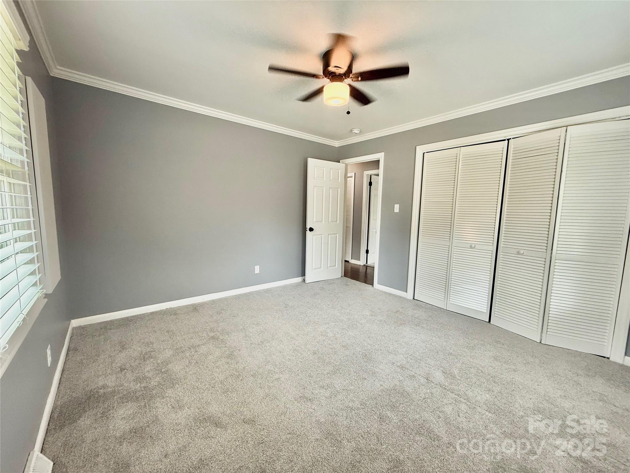 622 University Drive Rock Hill, SC 29730 - Photo 21 of 24 a view of a livingroom with a ceiling fan and window