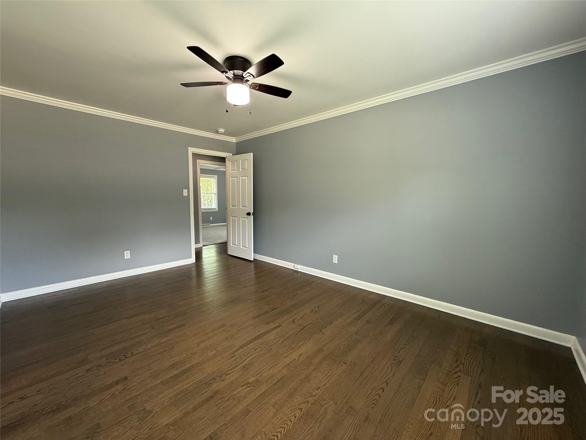 622 University Drive Rock Hill, SC 29730 - Photo 22 of 24 an empty room with wooden floor and ceiling fan