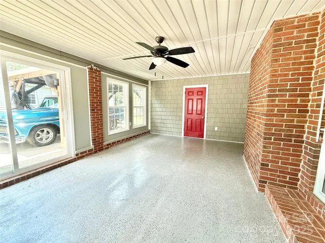 a view of empty room with windows