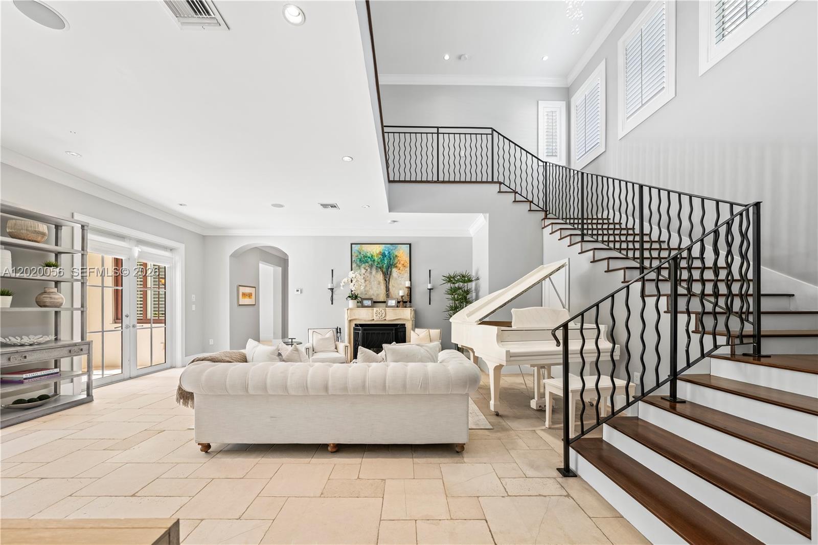 4196 Douglas Road Miami, FL 33133 - Photo 17 of 96 a living room with furniture and a chandelier