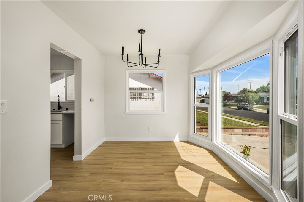 1013 West 138th Street Compton, CA 90222 - Photo 10 of 30 a view of a room with wooden floor and windows