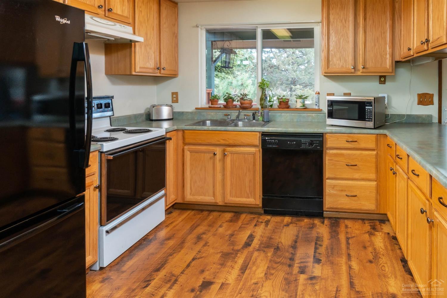 21452 Keyte Lane Bend, OR 97701 - Photo 17 of 25 Kitchen overlooks the back deck, canal,