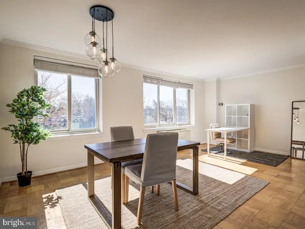 a workspace with furniture window and wooden floor
