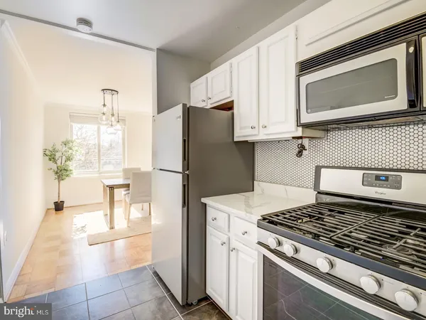 a kitchen with a stove and a microwave
