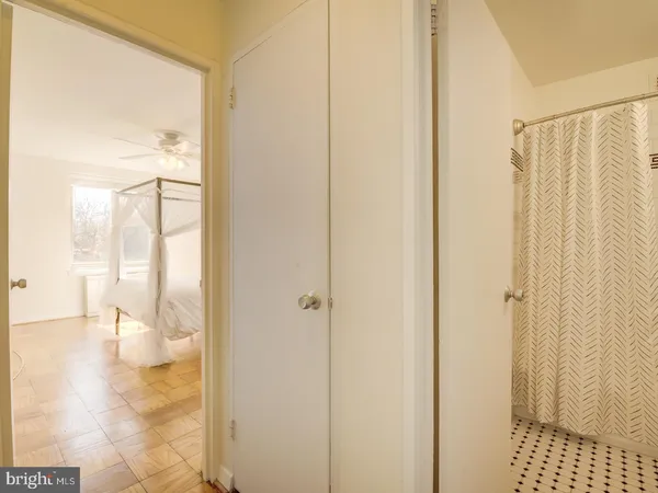 a bathroom with a shower and a bath tub