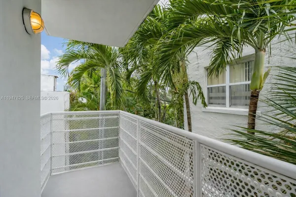 a view of a balcony with plants