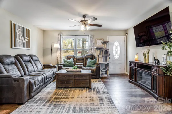 a living room with furniture and a flat screen tv