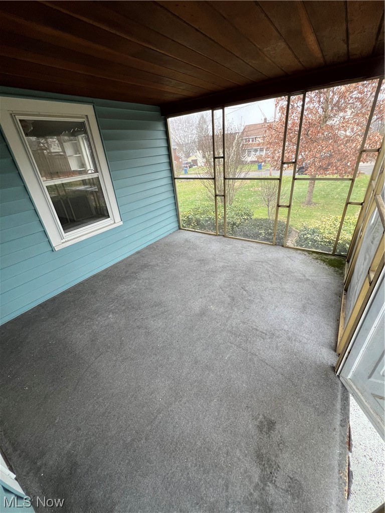 545 7th Street Struthers, OH 44471 - Photo 4 of 17 Unfurnished sunroom with plenty of natural light and wooden ceiling