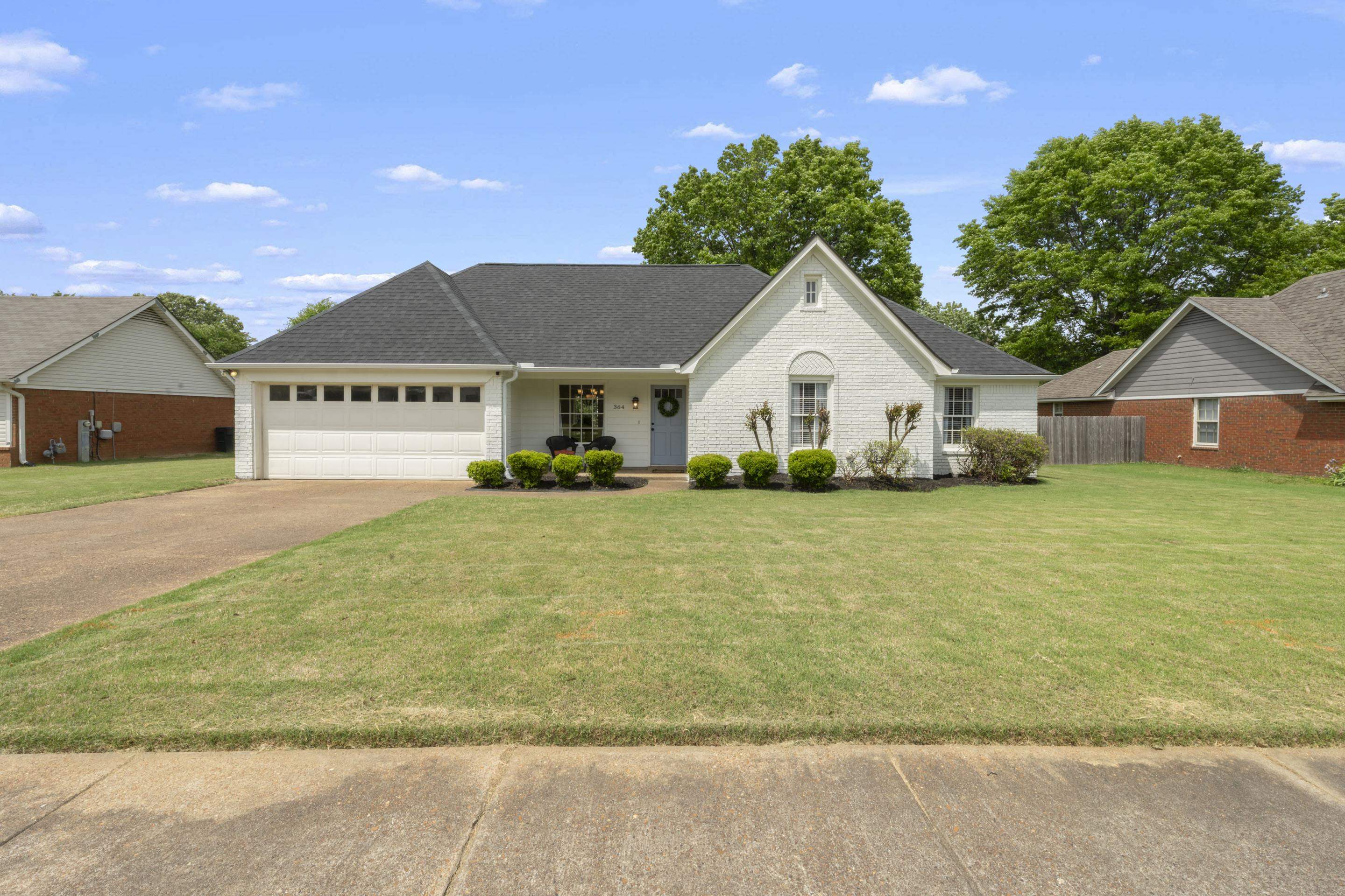 364 Rose Trellis Road Collierville, TN 38017 - Photo 1 of 28 a view of house with garden and tall trees