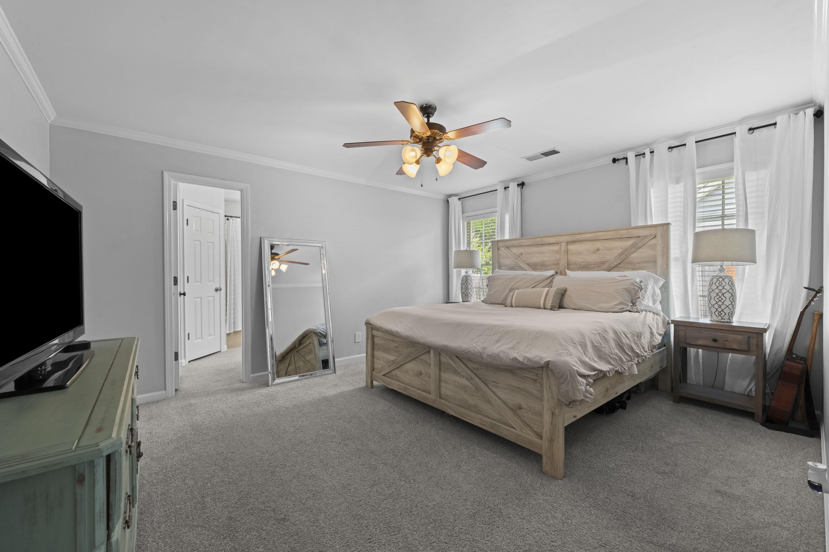 364 Rose Trellis Road Collierville, TN 38017 - Photo 16 of 28 a bedroom with a bed and a flat screen tv