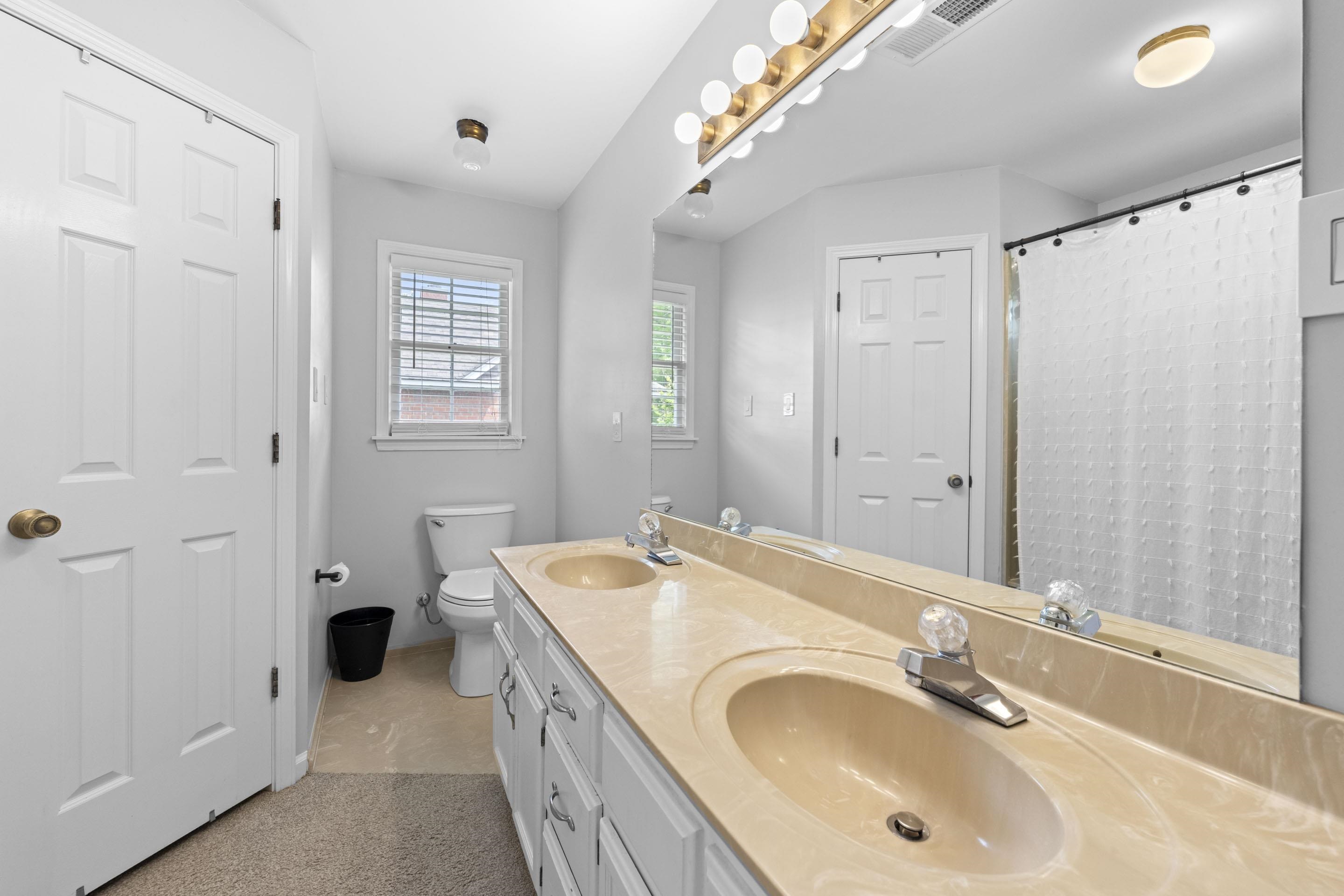 364 Rose Trellis Road Collierville, TN 38017 - Photo 18 of 28 a bathroom with a tub sink and mirror