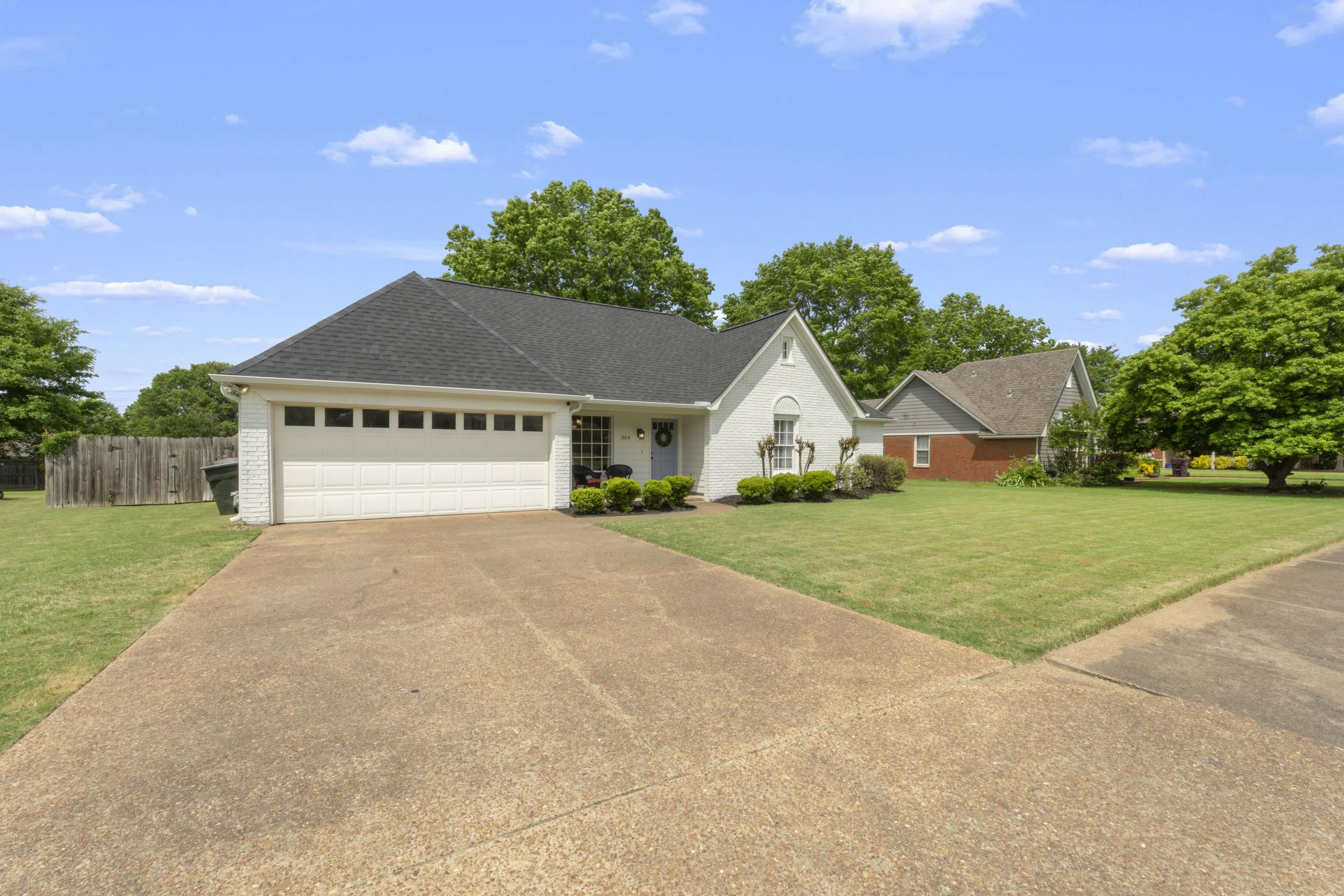 364 Rose Trellis Road Collierville, TN 38017 - Photo 2 of 28 a view of house with yard and garage