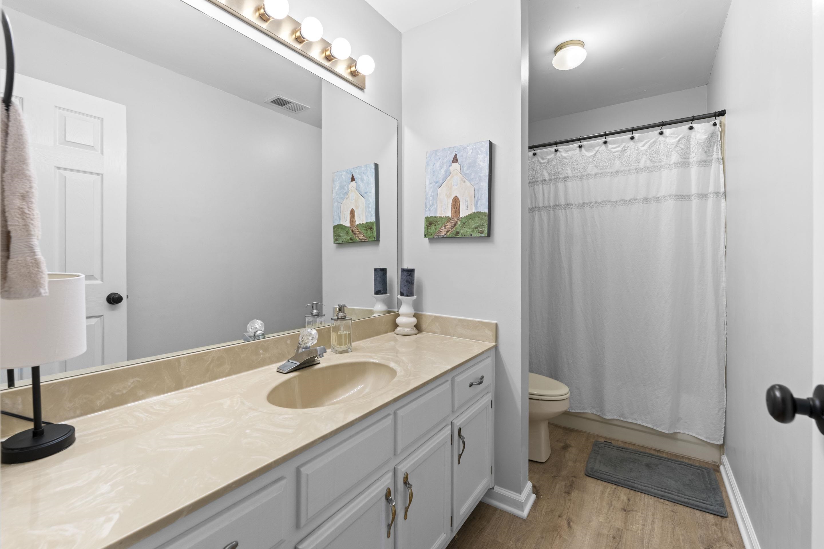 364 Rose Trellis Road Collierville, TN 38017 - Photo 22 of 28 a bathroom with a sink toilet and shower