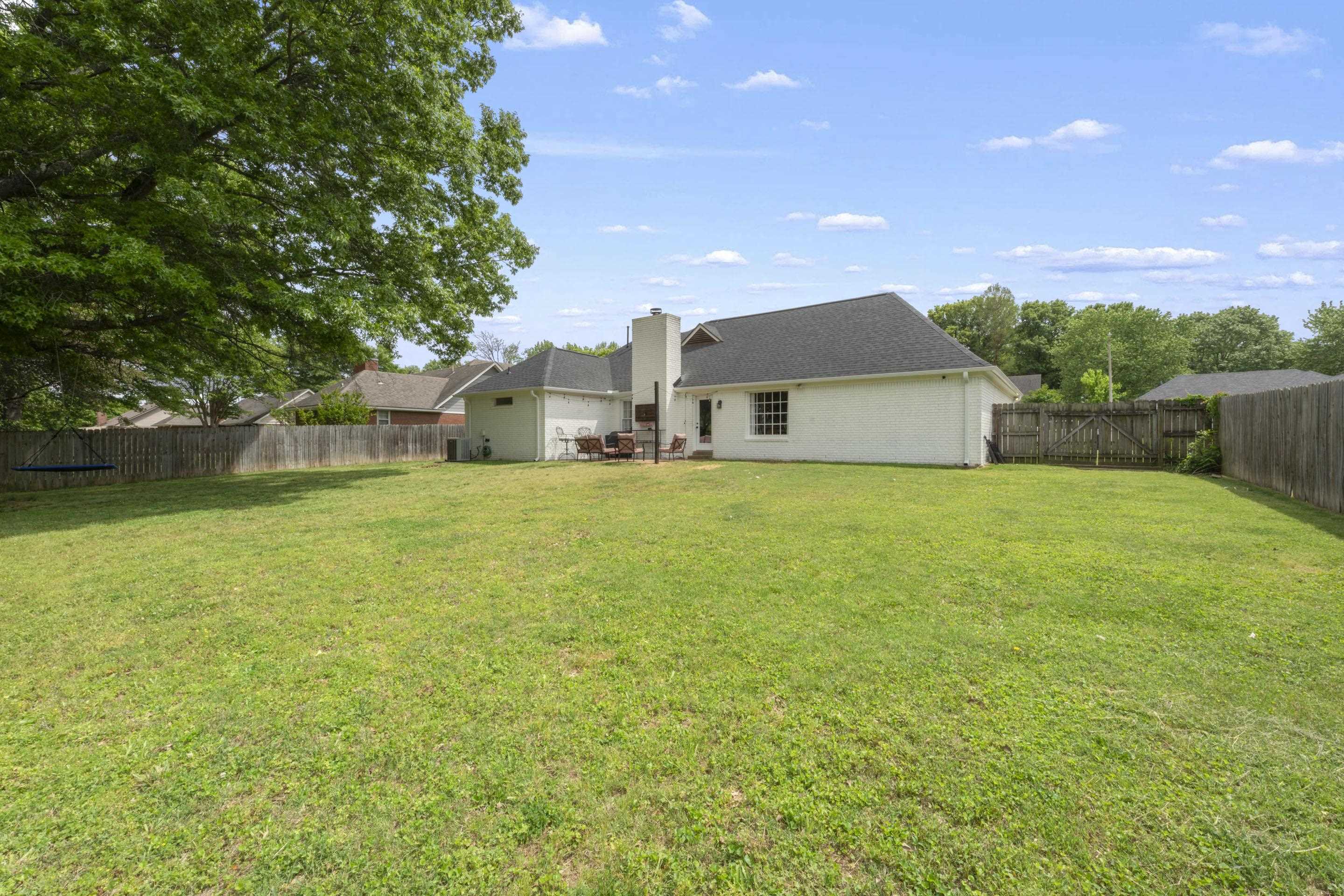 364 Rose Trellis Road Collierville, TN 38017 - Photo 26 of 28 a view of a house with a big yard