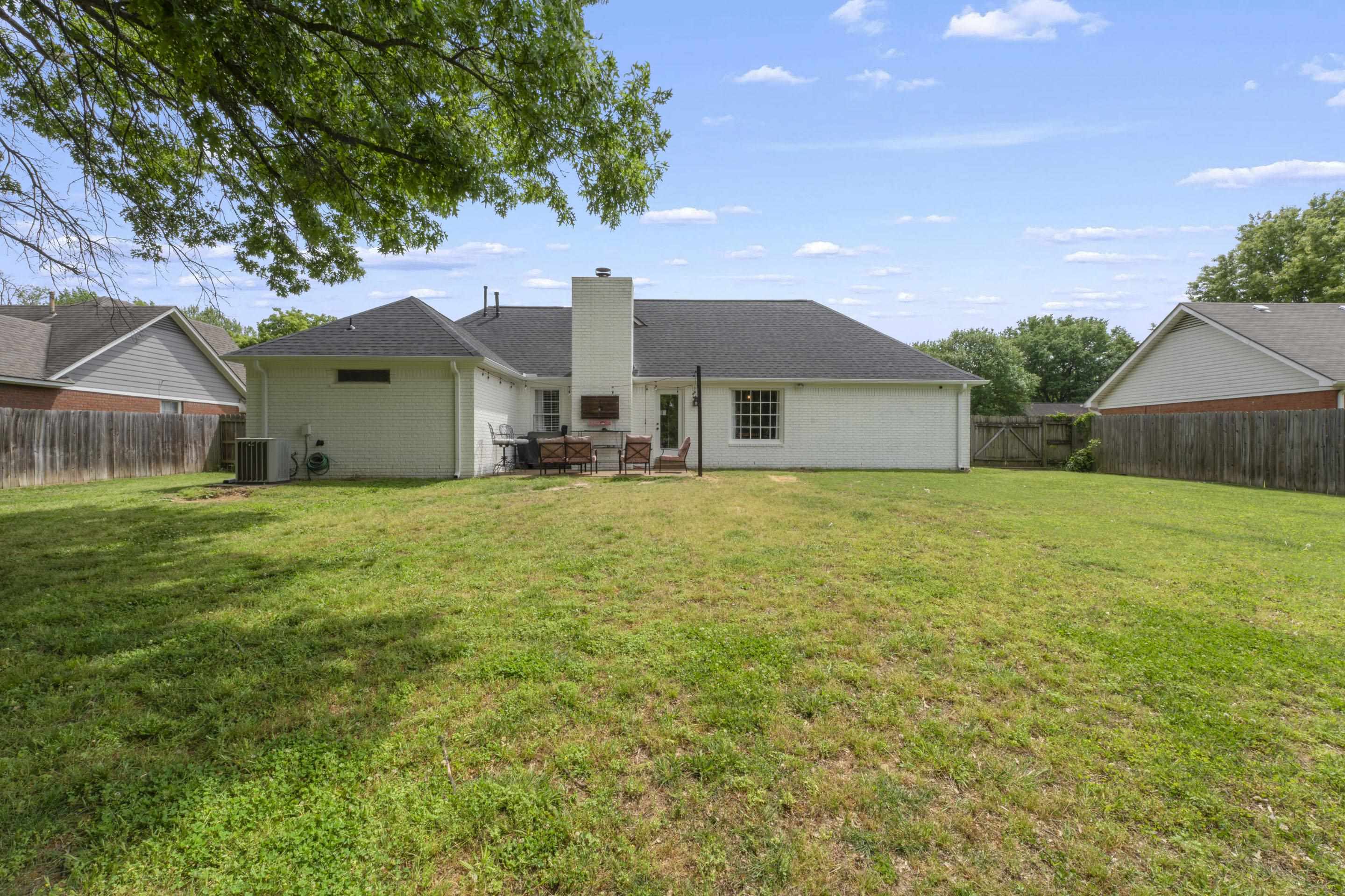 364 Rose Trellis Road Collierville, TN 38017 - Photo 27 of 28 a front view of house with yard and green space
