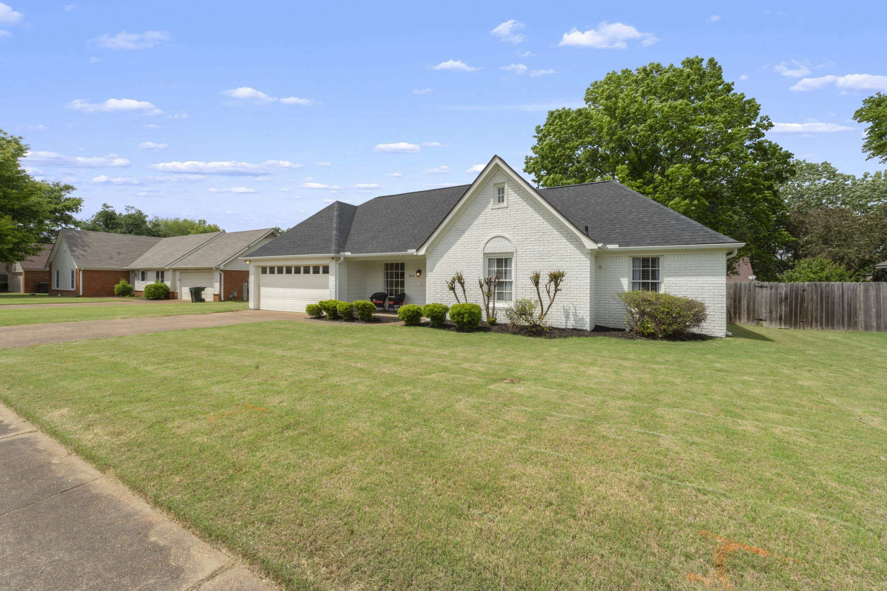 364 Rose Trellis Road Collierville, TN 38017 - Photo 3 of 28 a view of a house with a big yard and large trees