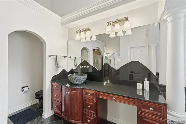 a bathroom with a sink and mirror