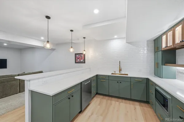 a kitchen with lots of counter space and a sink