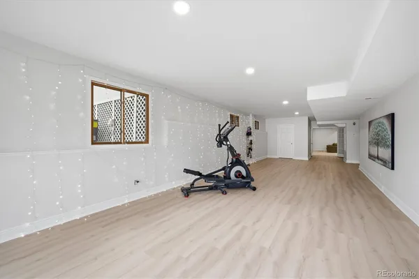 a view of a room with gym equipment and a large window