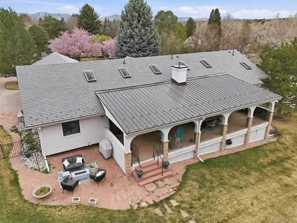 a aerial view of a house with pool table and chairs