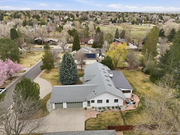 an aerial view of a house with outdoor space
