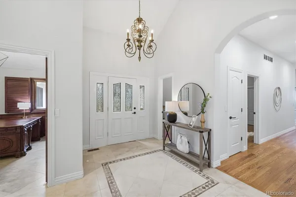 a view of a livingroom with furniture and front door