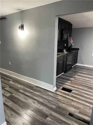 a view of a livingroom with wooden floor