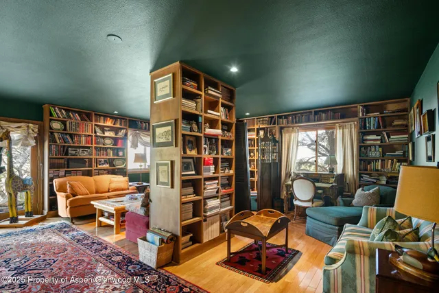 a bathroom with a sink mirror and toilet