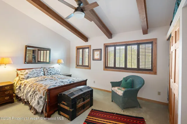 a view of a deck with furniture and trees