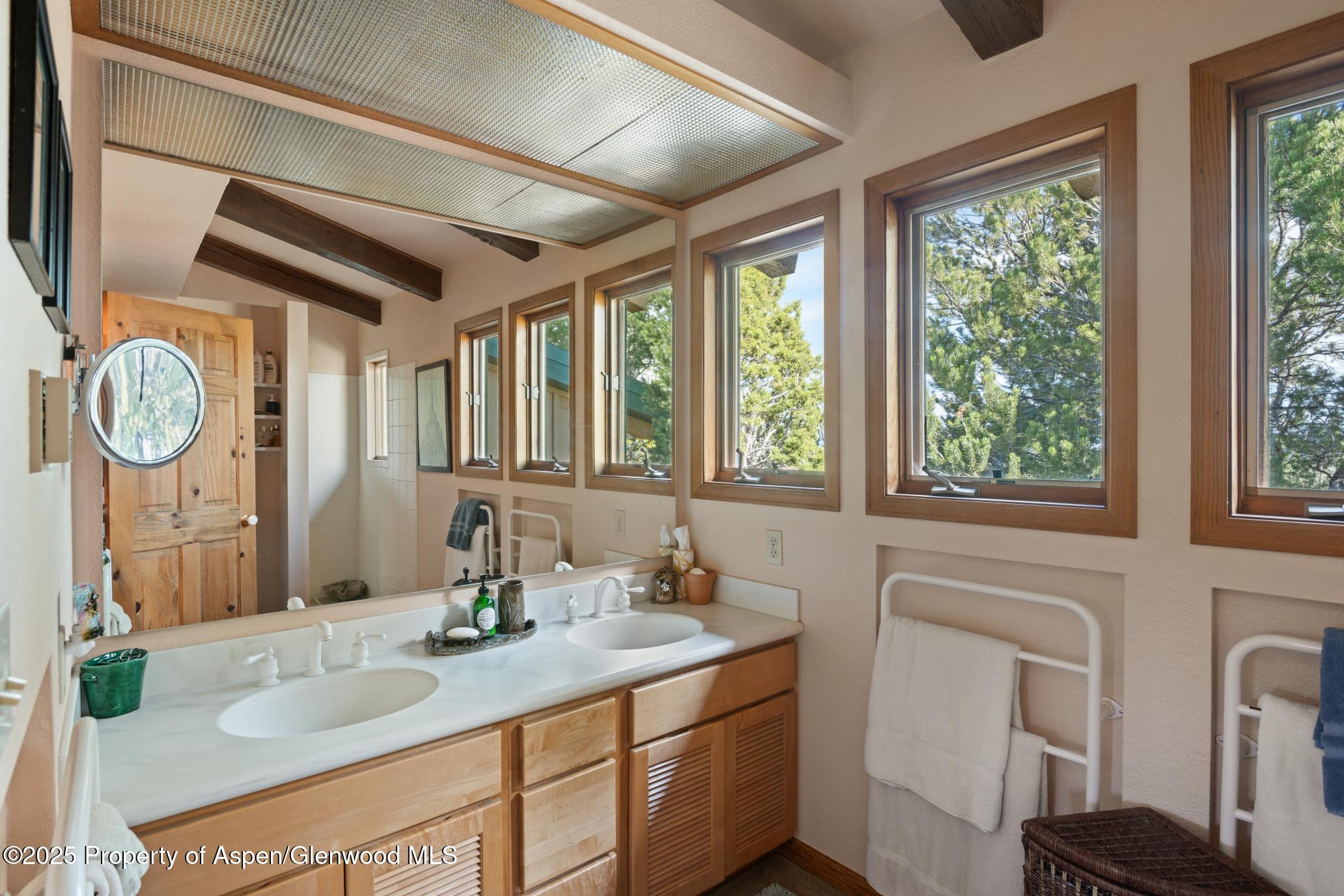 4440 County Road 342 Silt, CO 81652 - Photo 28 of 62 a bathroom with a granite countertop sink and a large mirror