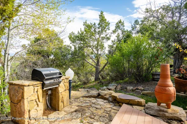 a bathroom with a sink and mirror with window