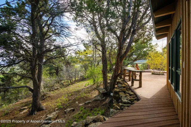 a view of a chairs and table in the patio