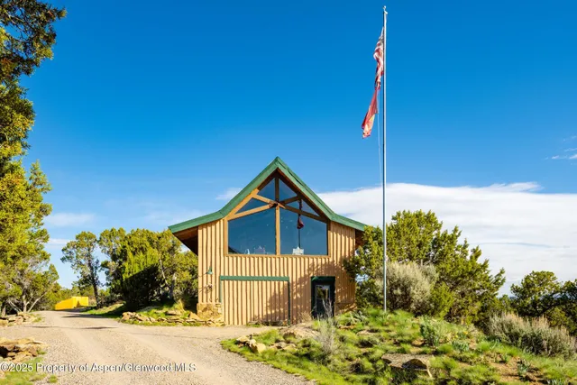 a bathroom with a granite countertop shower and a sink