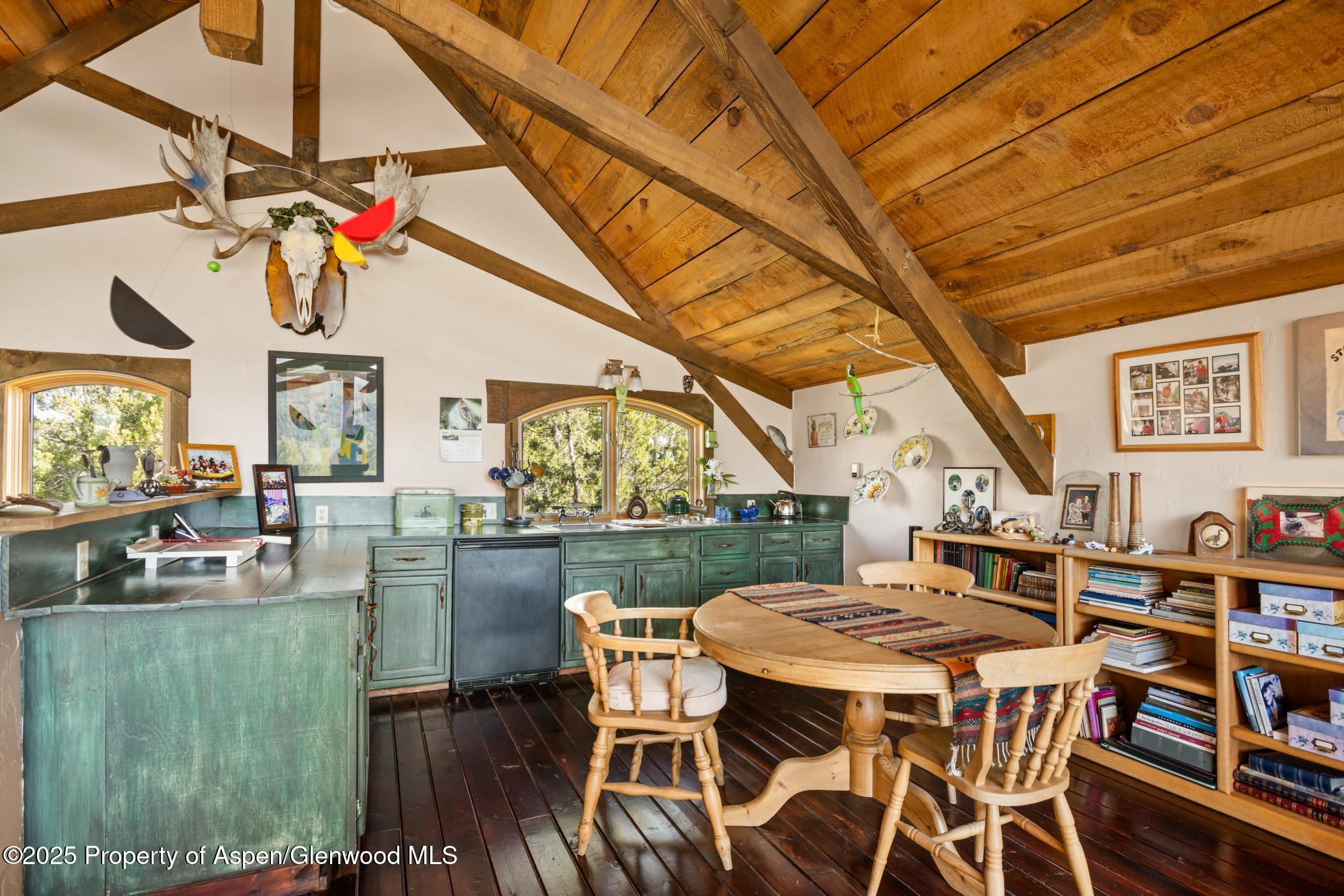 4440 County Road 342 Silt, CO 81652 - Photo 49 of 62 a view of a dining room with furniture a rug and wooden floor