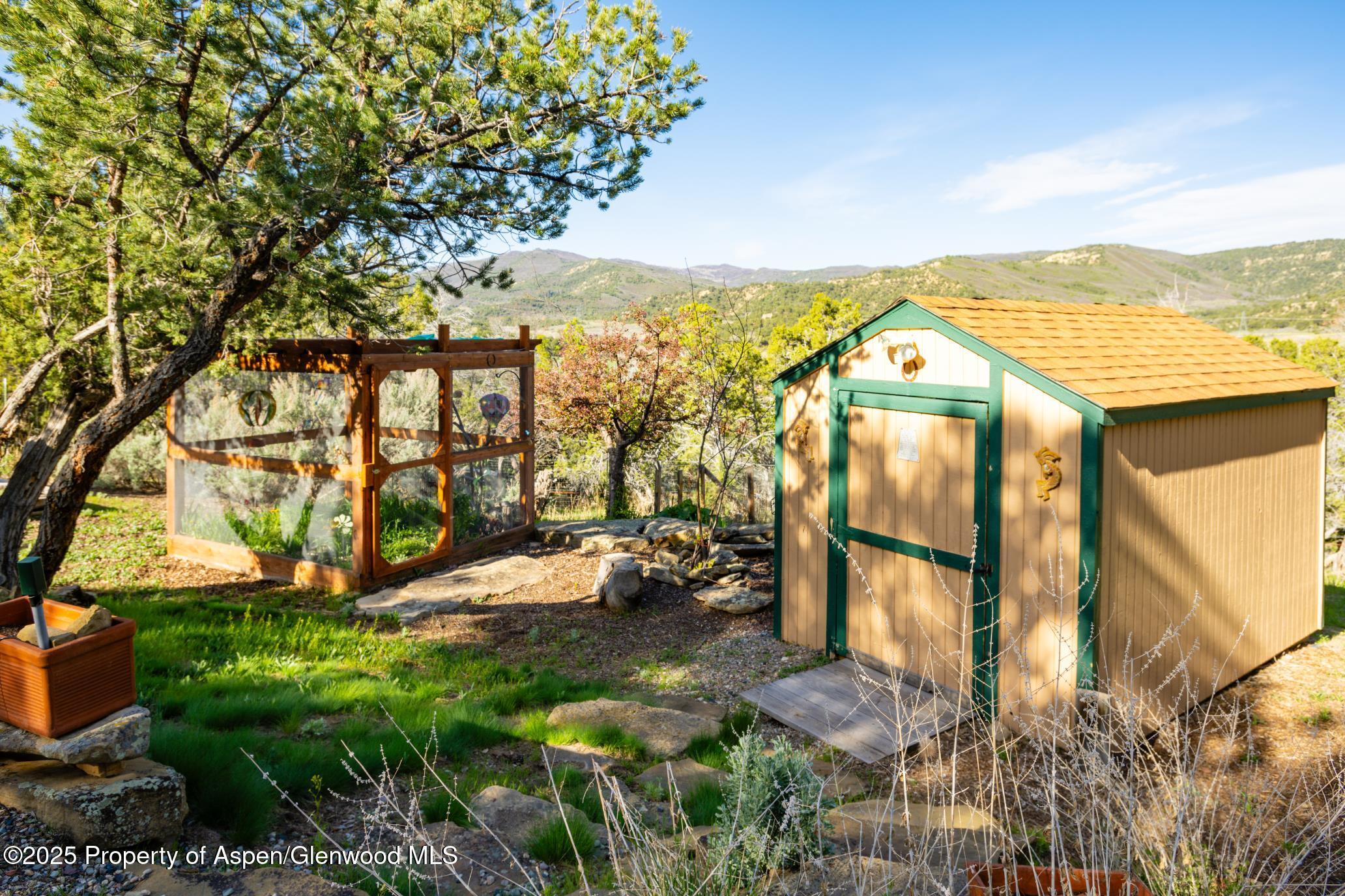 4440 County Road 342 Silt, CO 81652 - Photo 55 of 62 a view of swimming pool with an outdoor seating and a yard