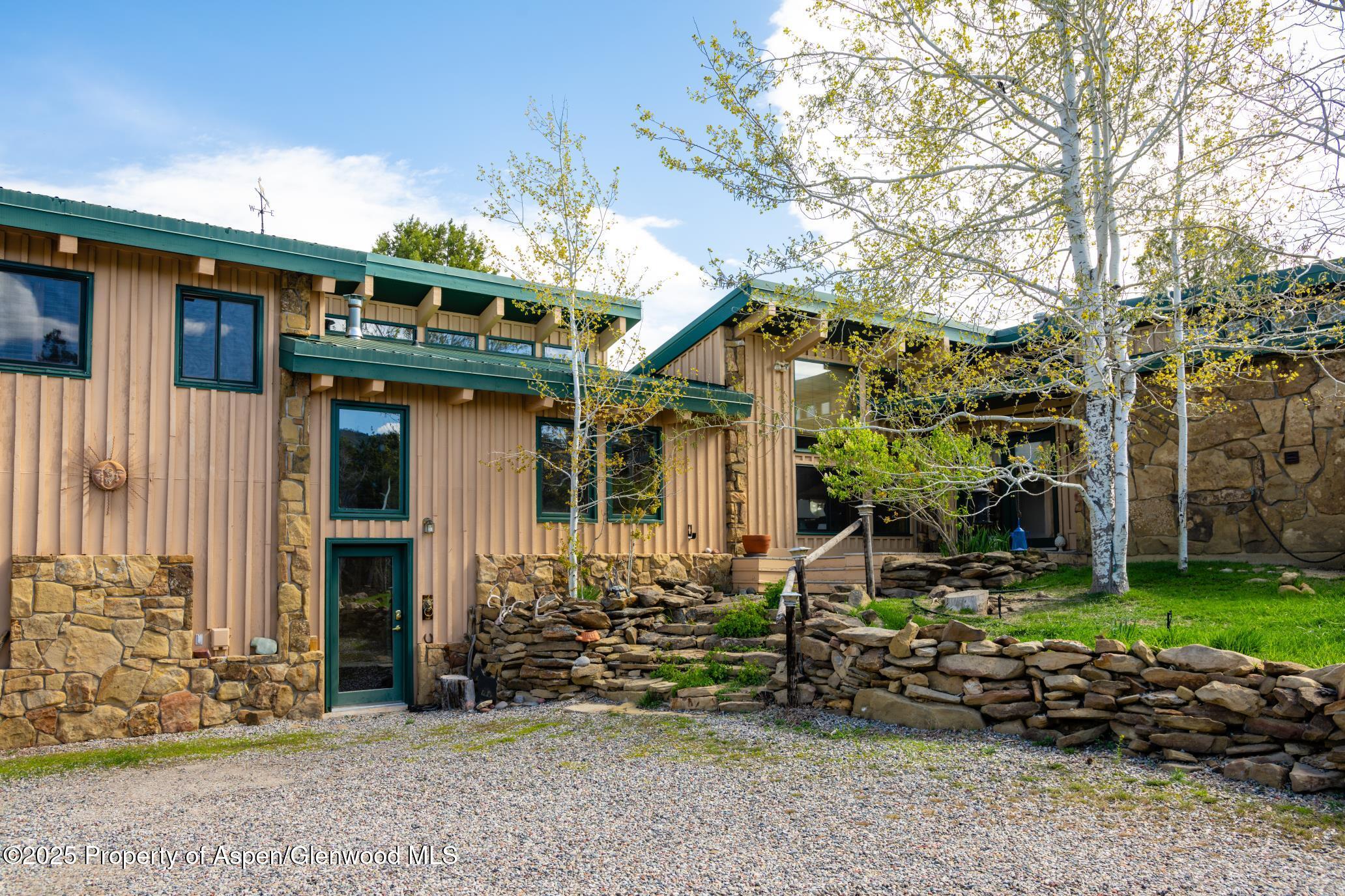 4440 County Road 342 Silt, CO 81652 - Photo 57 of 62 a front view of a house with garden