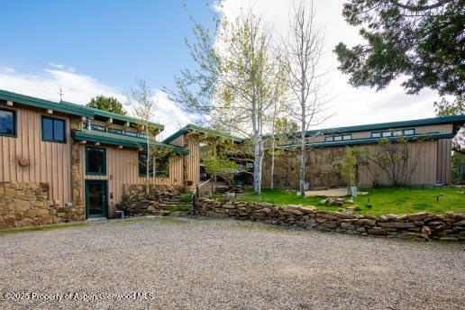 4440 County Road 342 Silt, CO 81652 - Photo 58 of 62 a front view of a house with garden