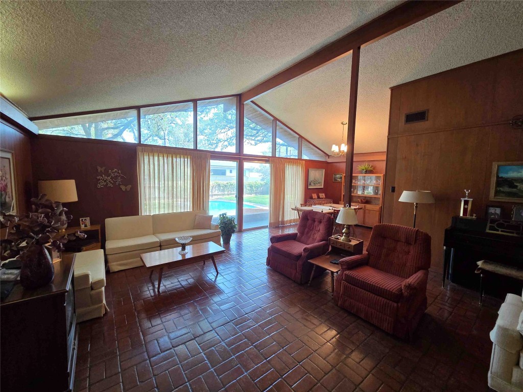 402 Honeycomb Ridge Austin, TX 78746 - Photo 15 of 40 a living room with furniture and a large window