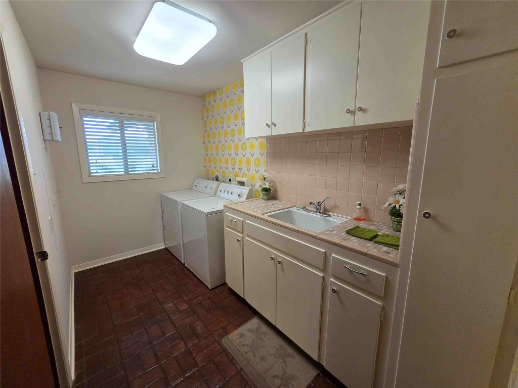 402 Honeycomb Ridge Austin, TX 78746 - Photo 27 of 40 a utility room with sink dryer and washer