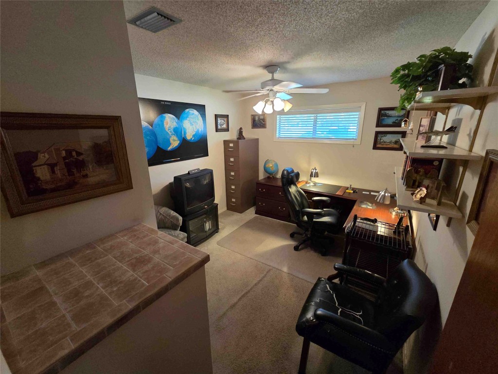 402 Honeycomb Ridge Austin, TX 78746 - Photo 35 of 40 a living room with furniture and a flat screen tv