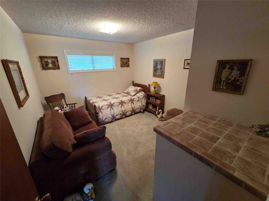 402 Honeycomb Ridge Austin, TX 78746 - Photo 36 of 40 a bed room with a bed and a couch